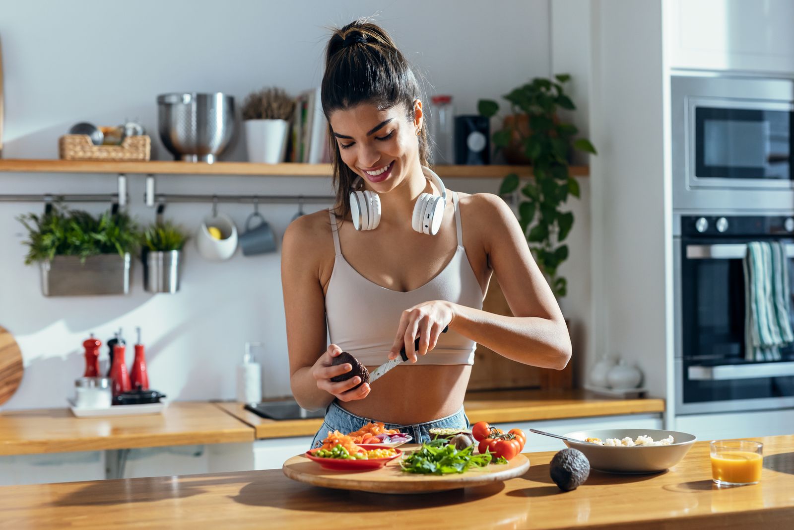 Woman preparing a healthy meal in her kitchen
